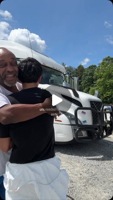 Cruise and Clean team member hugging a happy customer by a truck